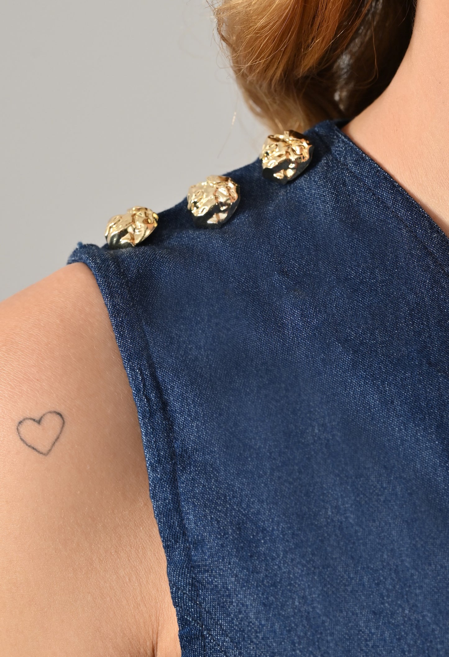 Blue denim waistcoat and skirt with golden buttons