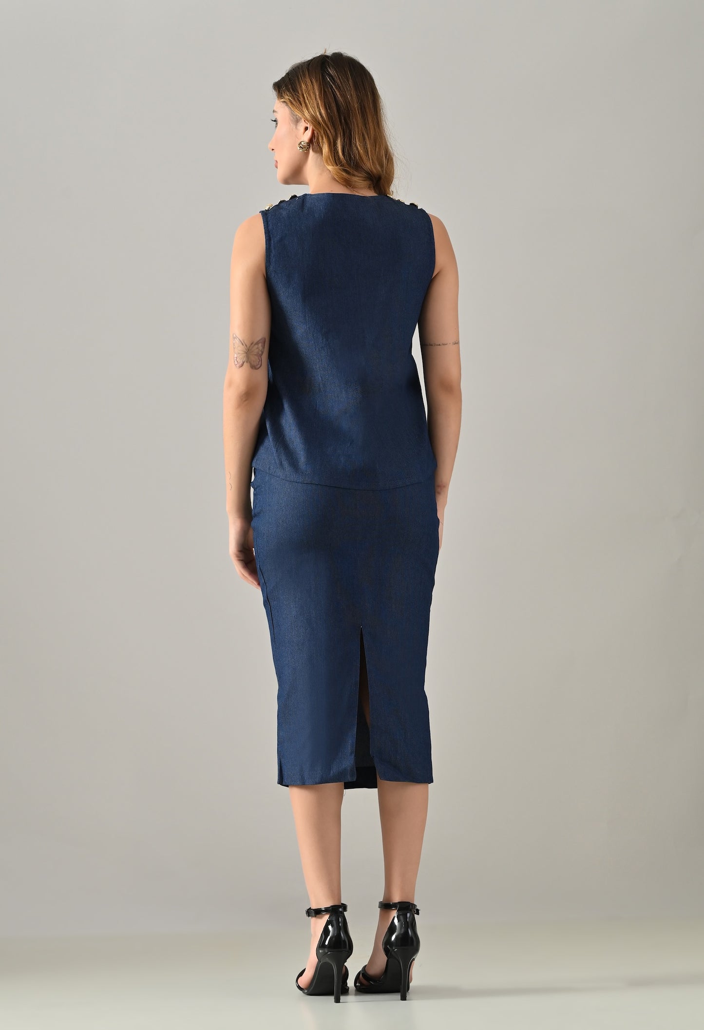 Blue denim waistcoat and skirt with golden buttons