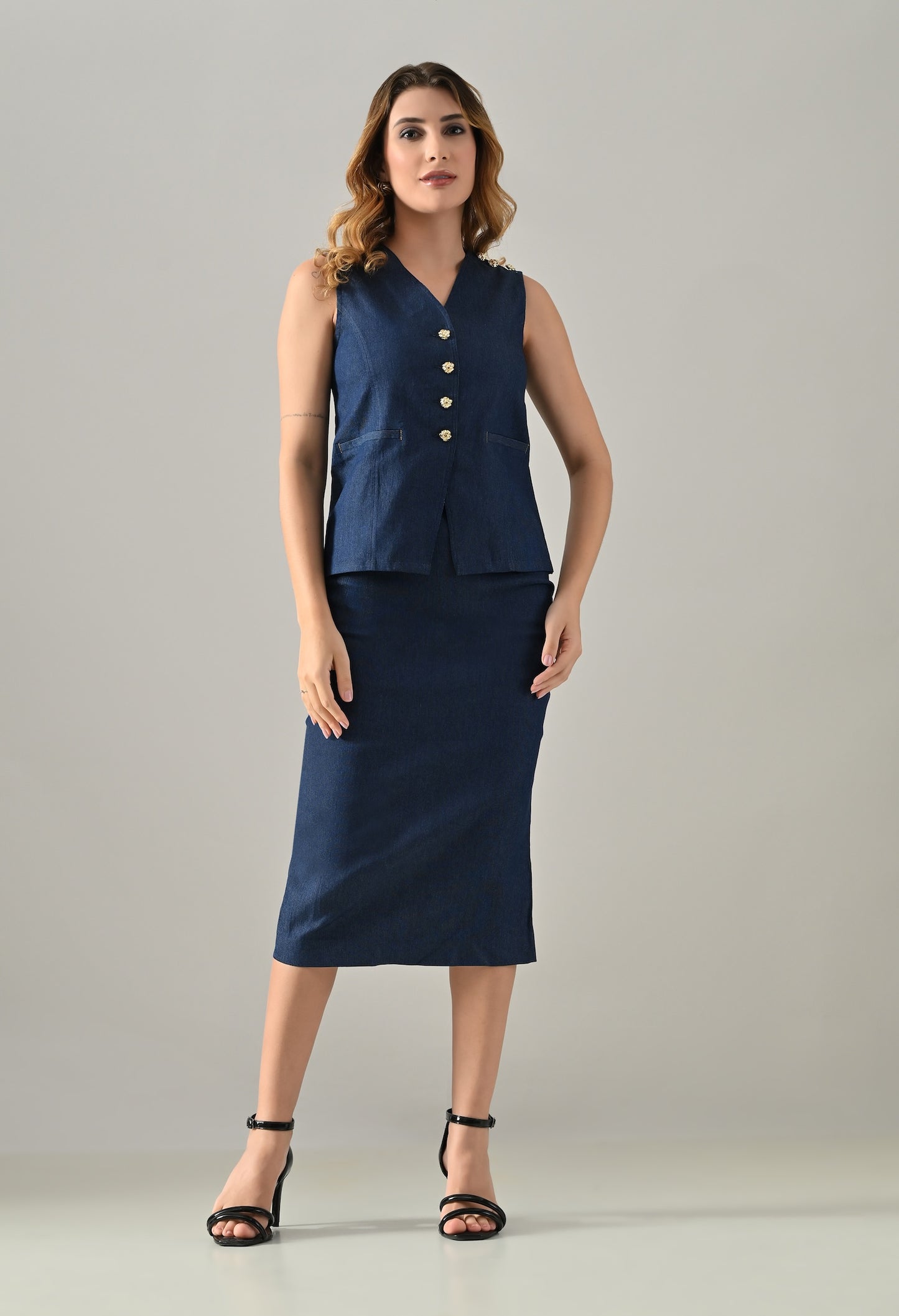 Blue denim waistcoat and skirt with golden buttons