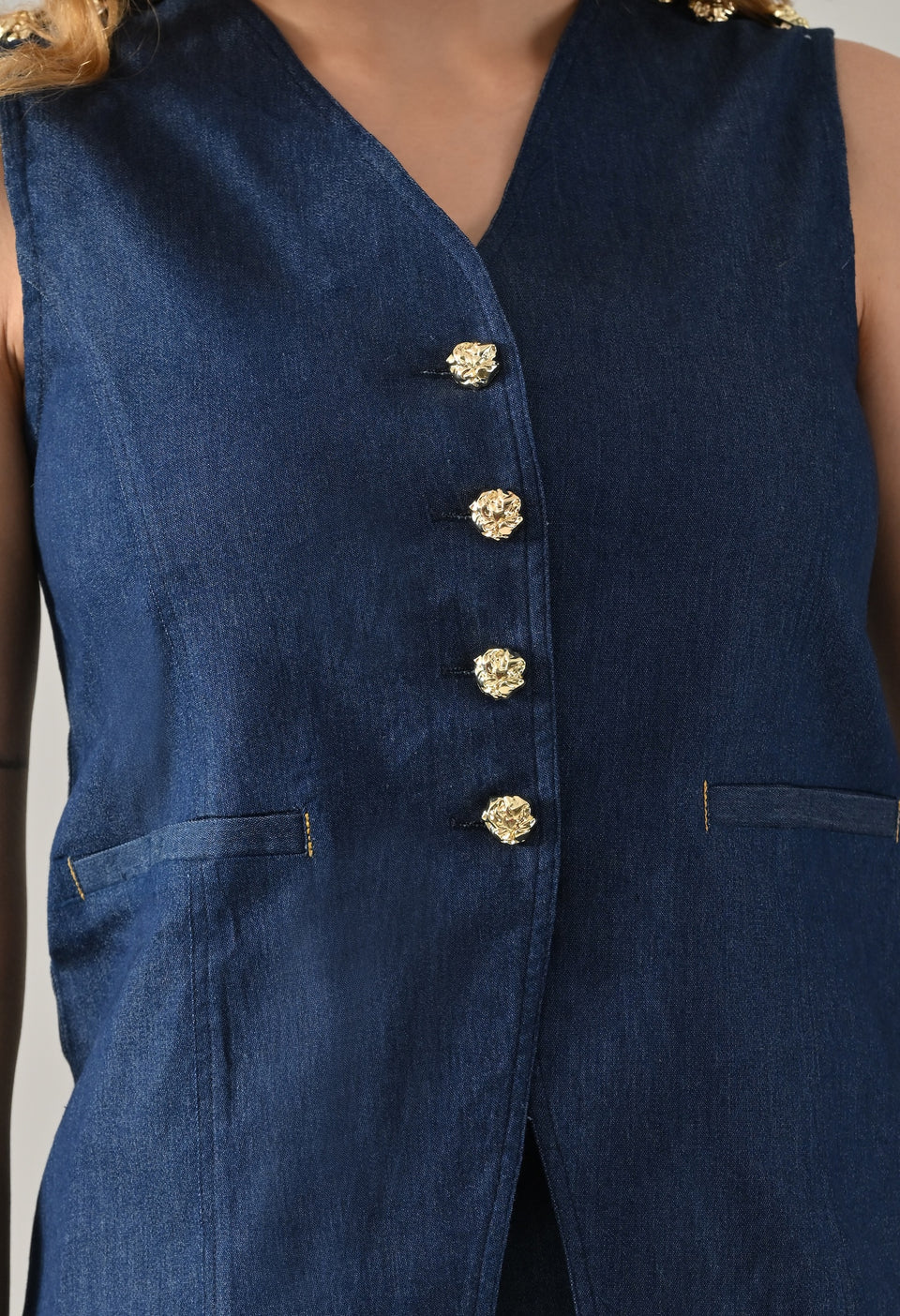 Blue denim waistcoat and skirt with golden buttons