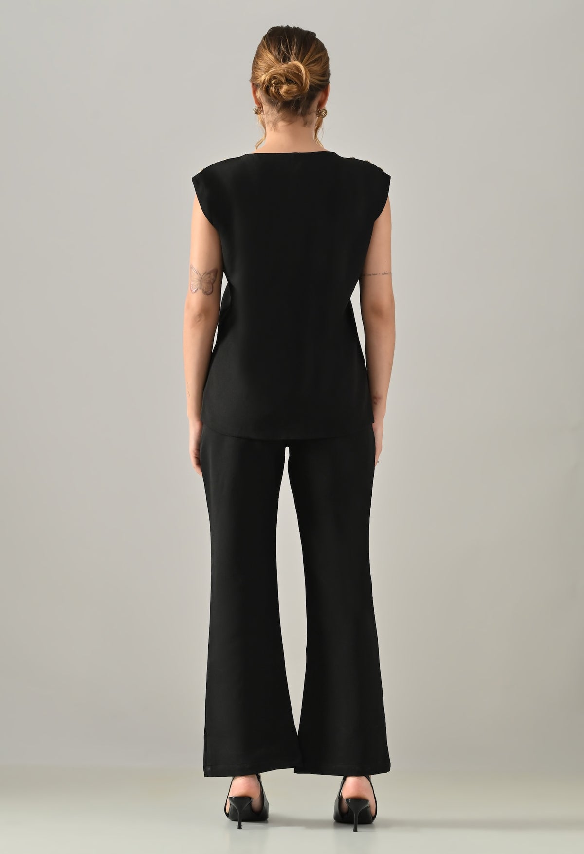Black waistcoat with golden buttons and black flared pants