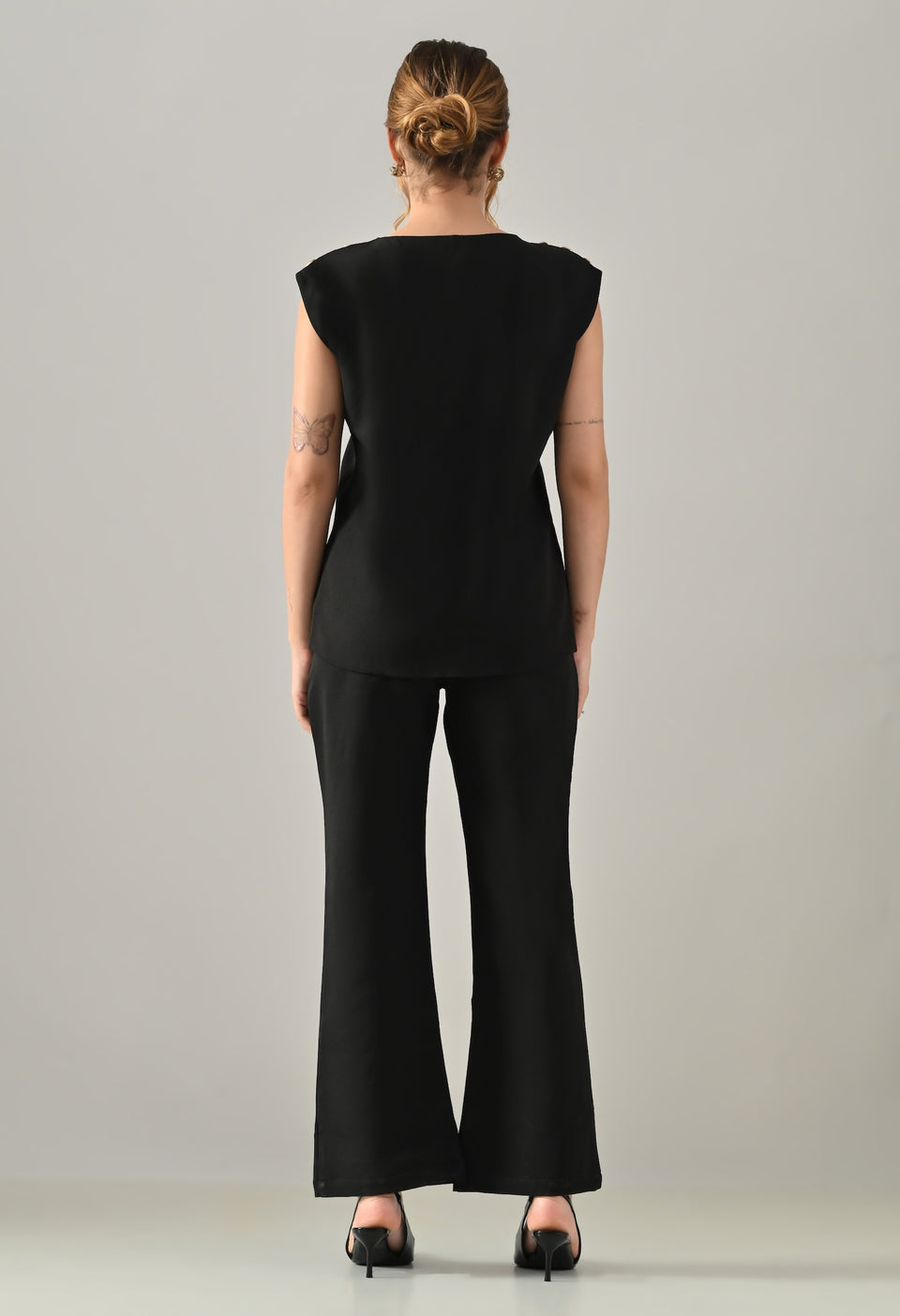 Black waistcoat with golden buttons and black flared pants