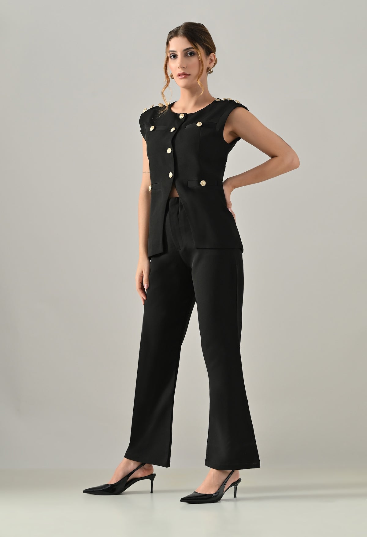 Black waistcoat with golden buttons and black flared pants