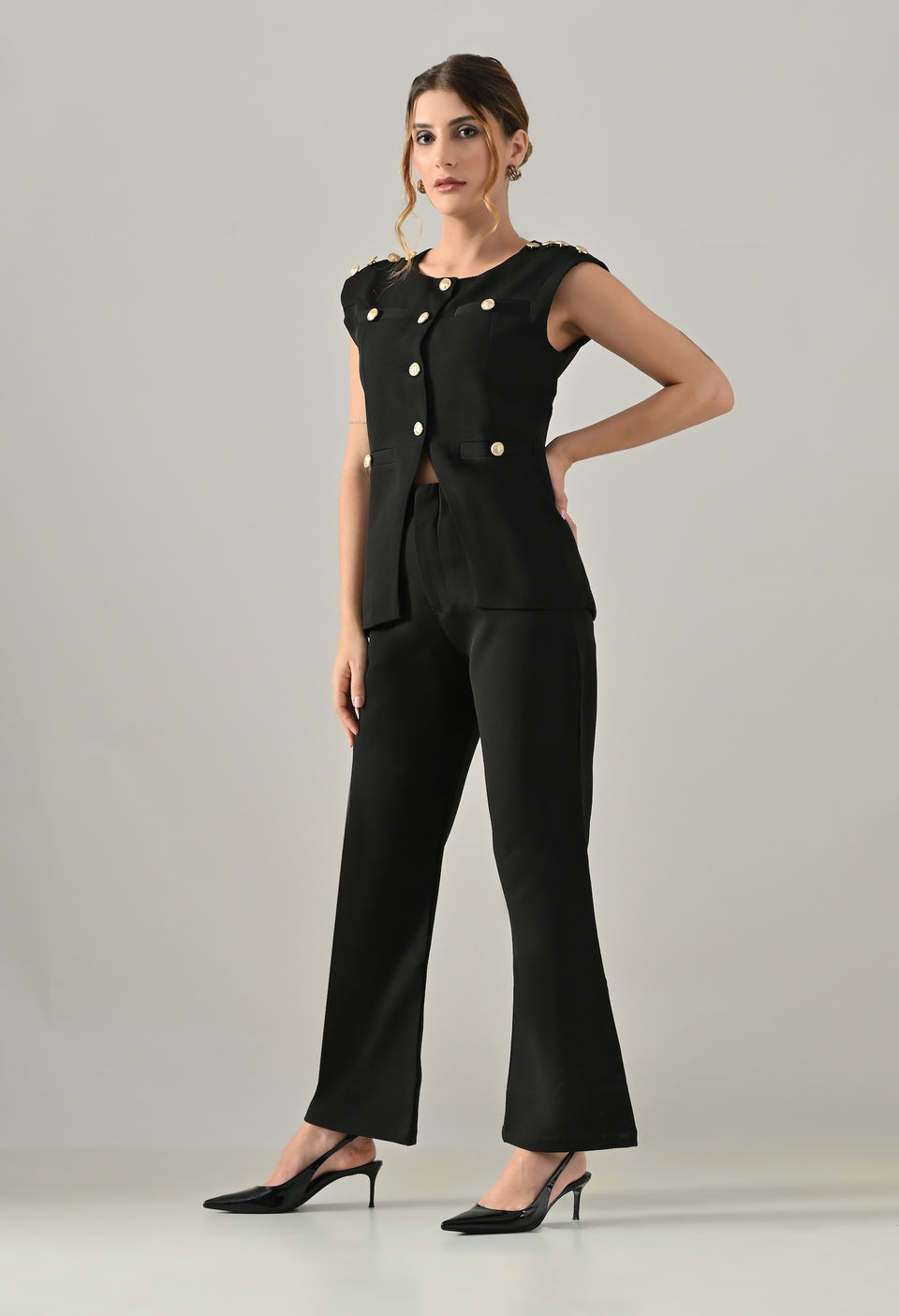 Black waistcoat with golden buttons and black flared pants