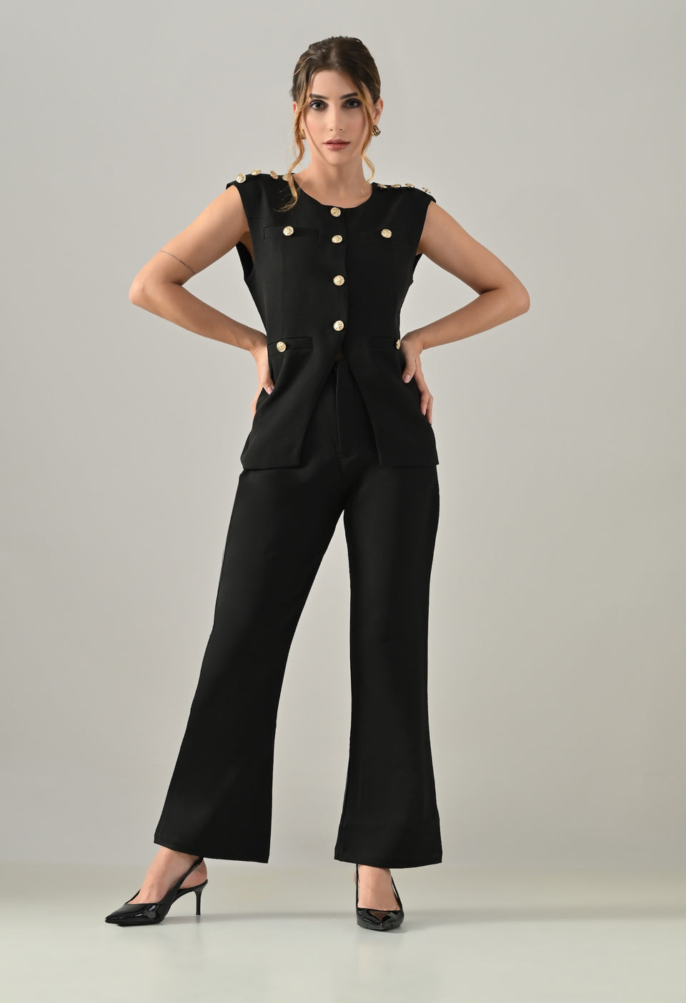 Black waistcoat with golden buttons and black flared pants