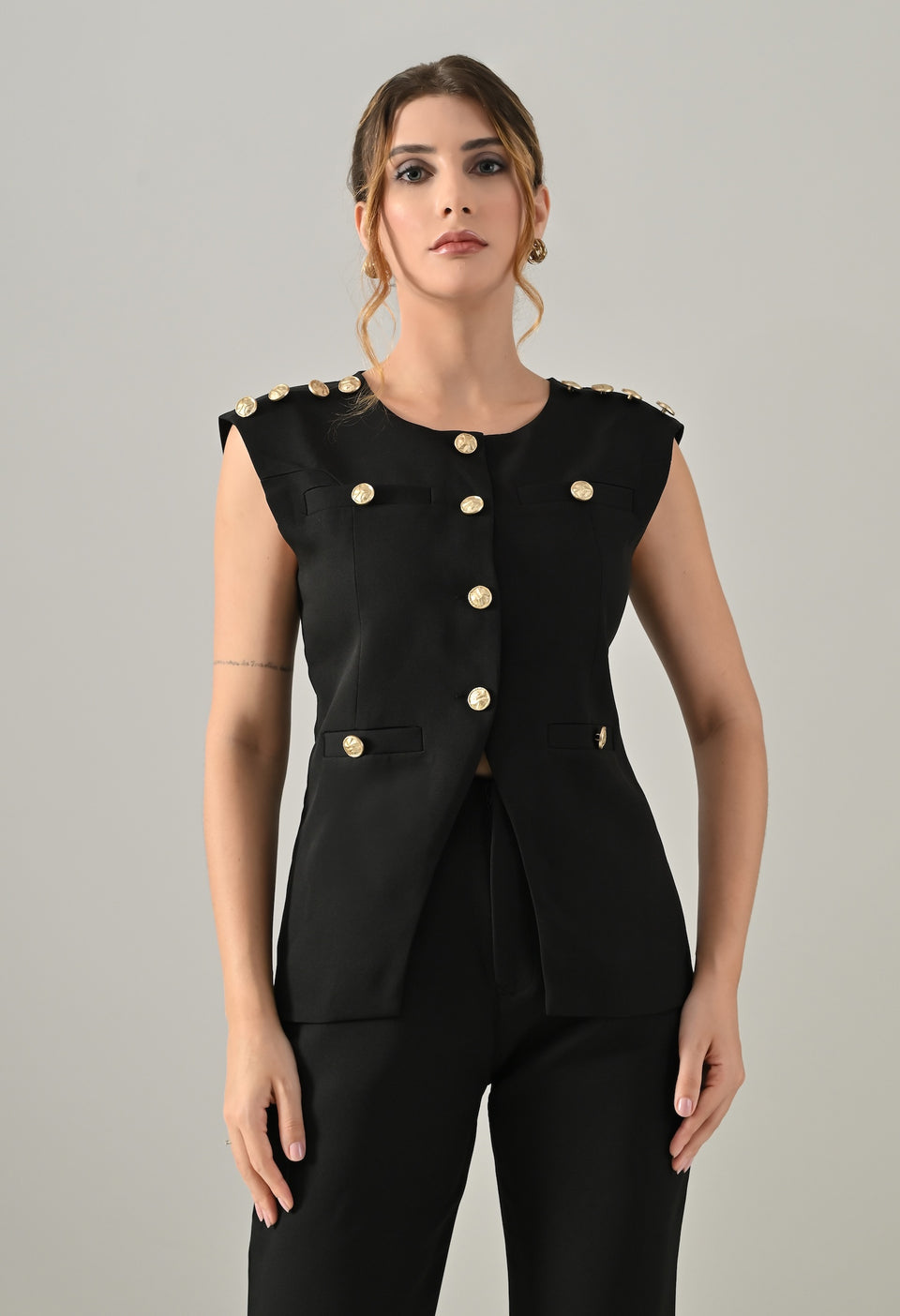 Black waistcoat with golden buttons and black flared pants