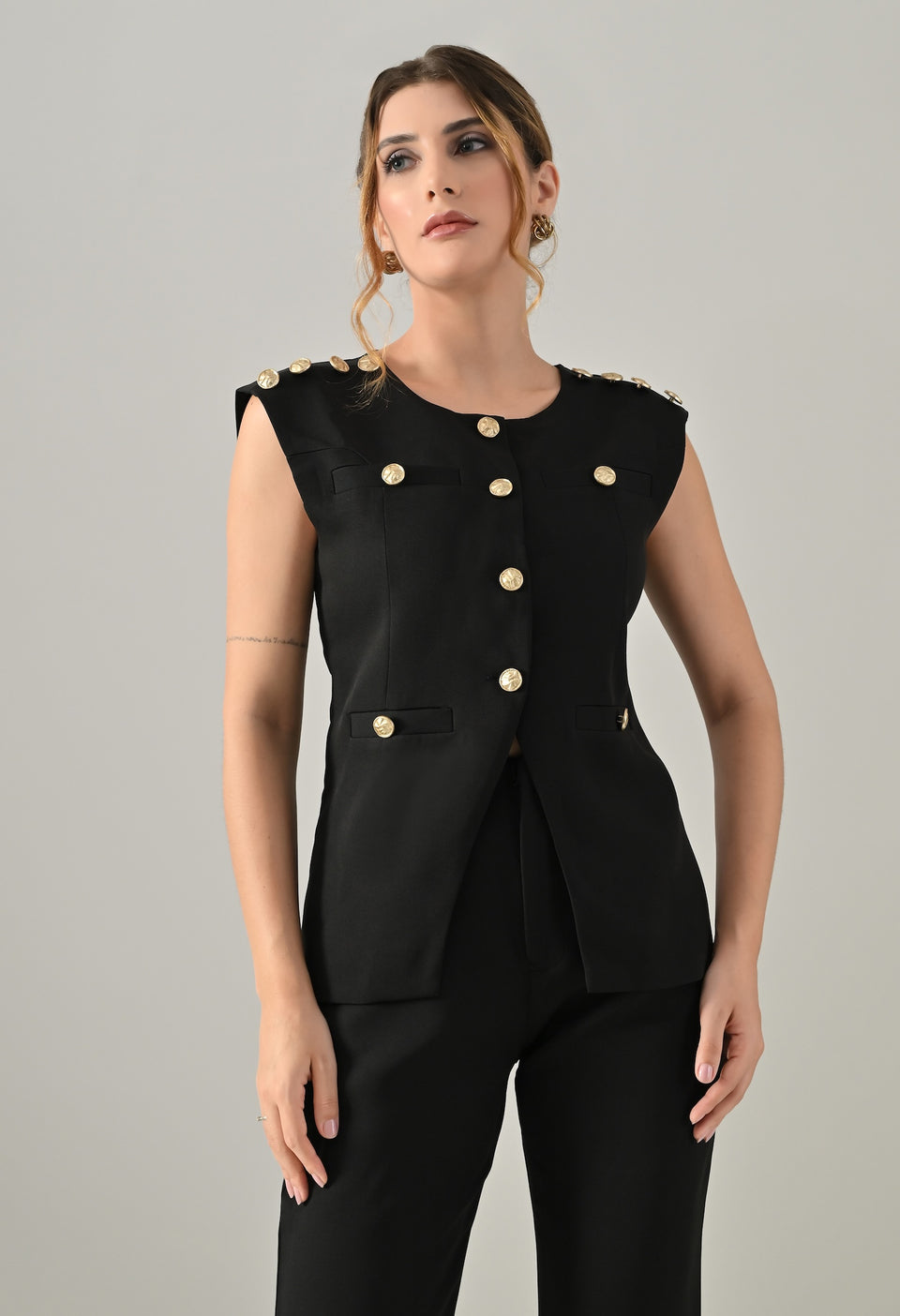 Black waistcoat with golden buttons and black flared pants