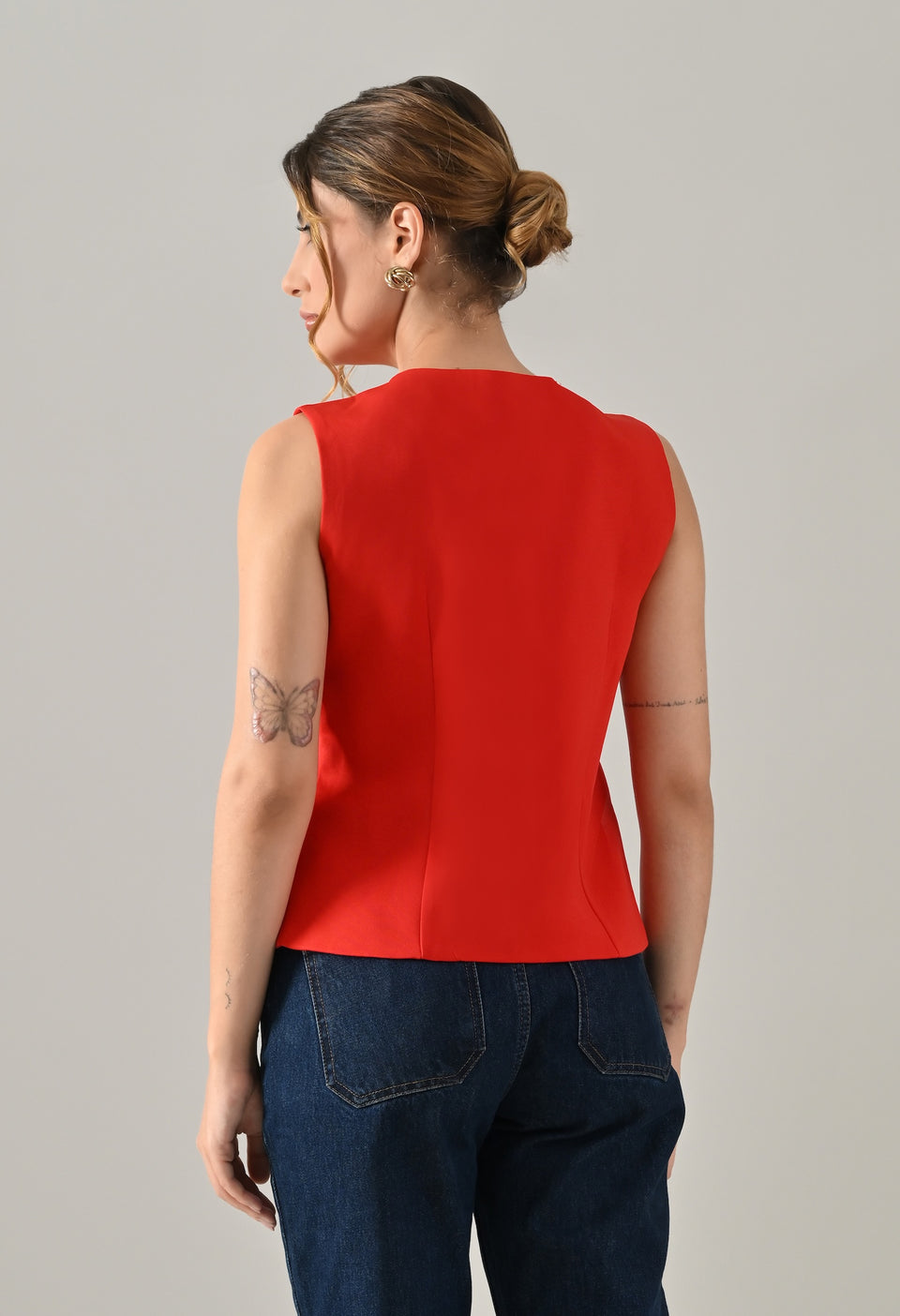 Red waistcoat with gold button detailing