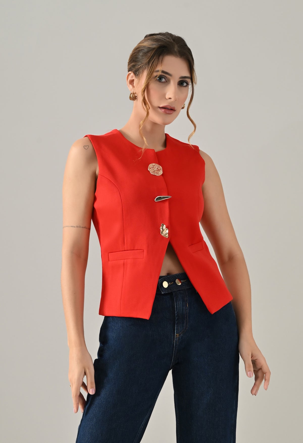 Red waistcoat with gold button detailing
