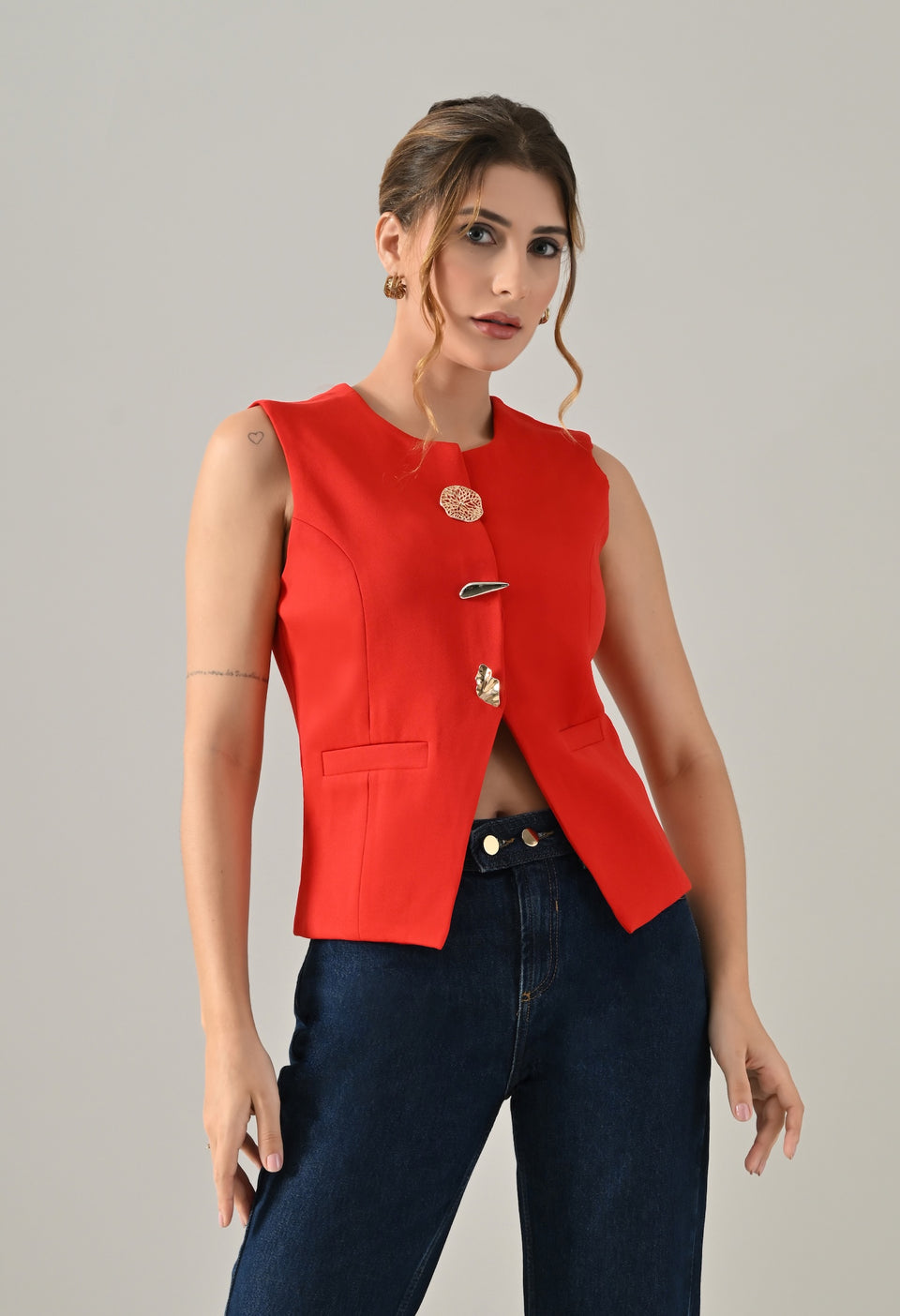 Red waistcoat with gold button detailing
