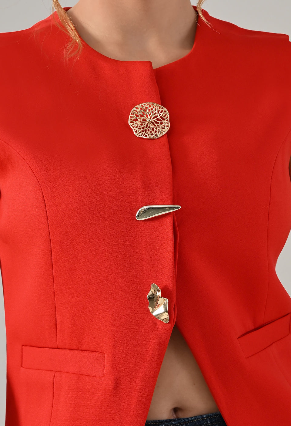 Red waistcoat with gold button detailing