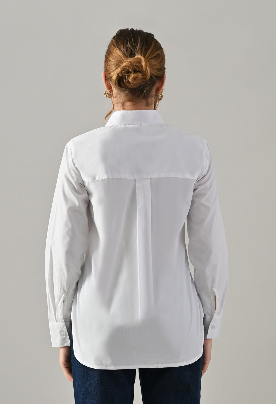 White shirt with golden buttons