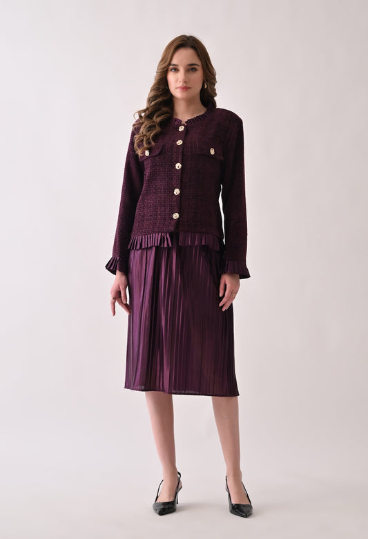 Wine colored tweed jacket with gold buttons and ruffle details paired with a matching pleated midi skirt