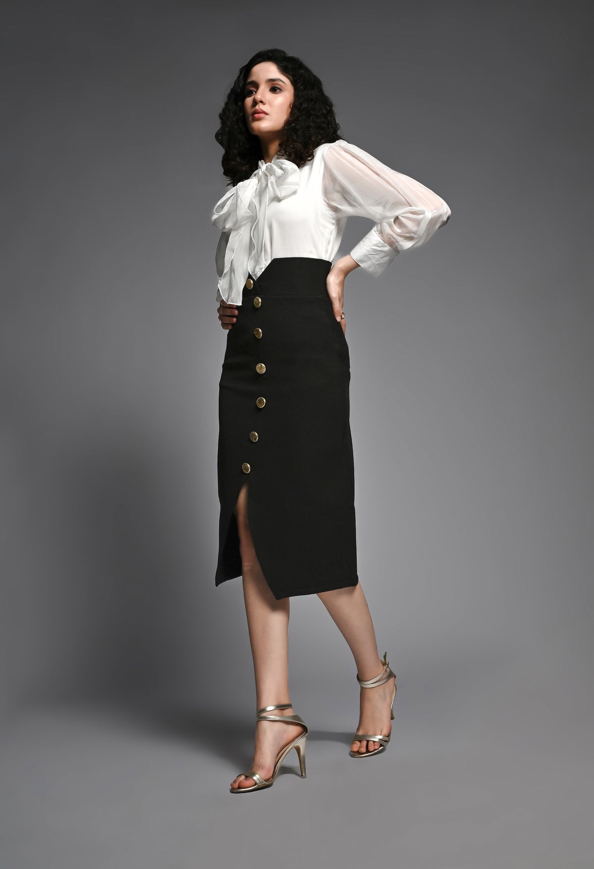 Black pencil skirt with golden buttons