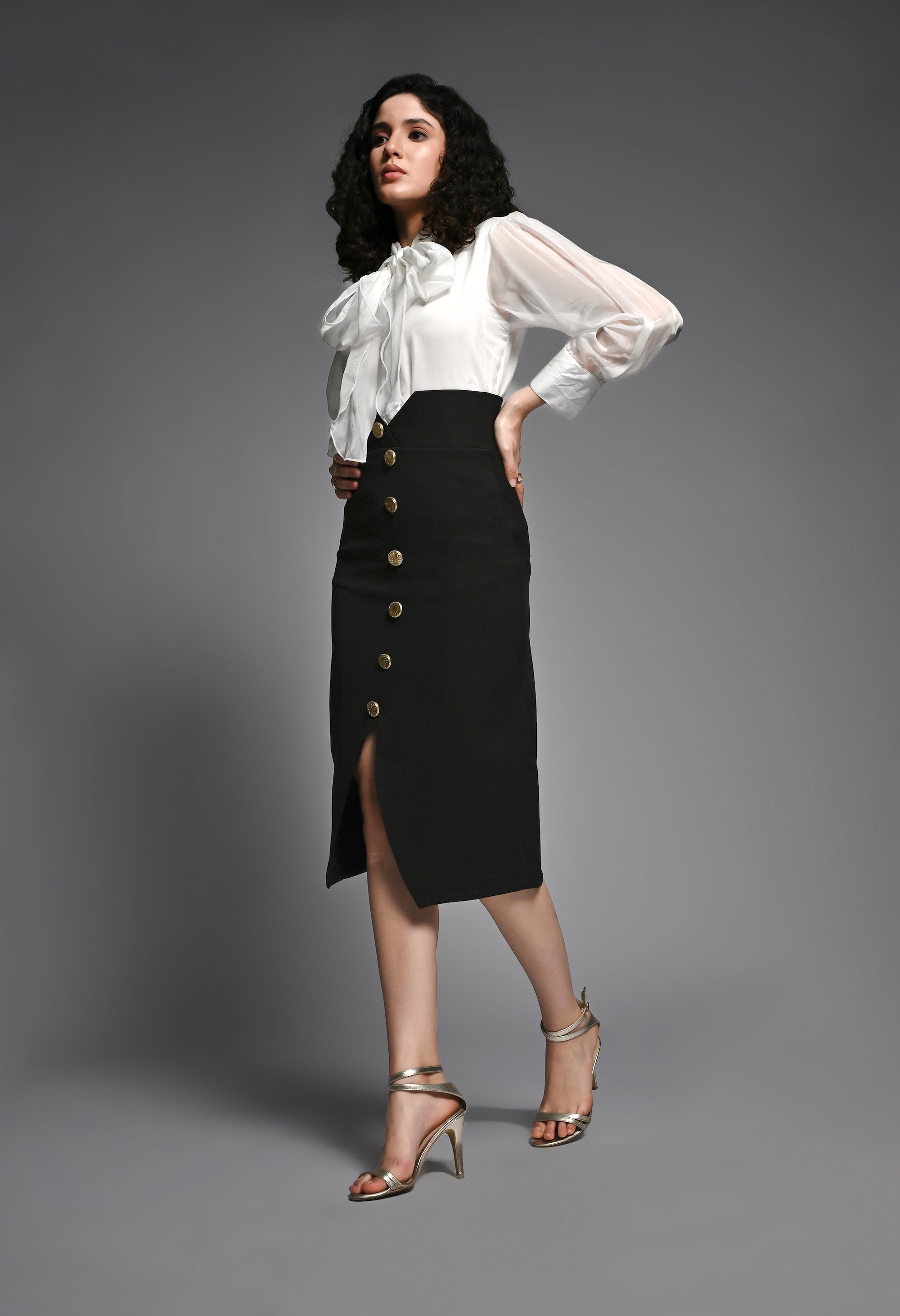 Black pencil skirt with golden buttons