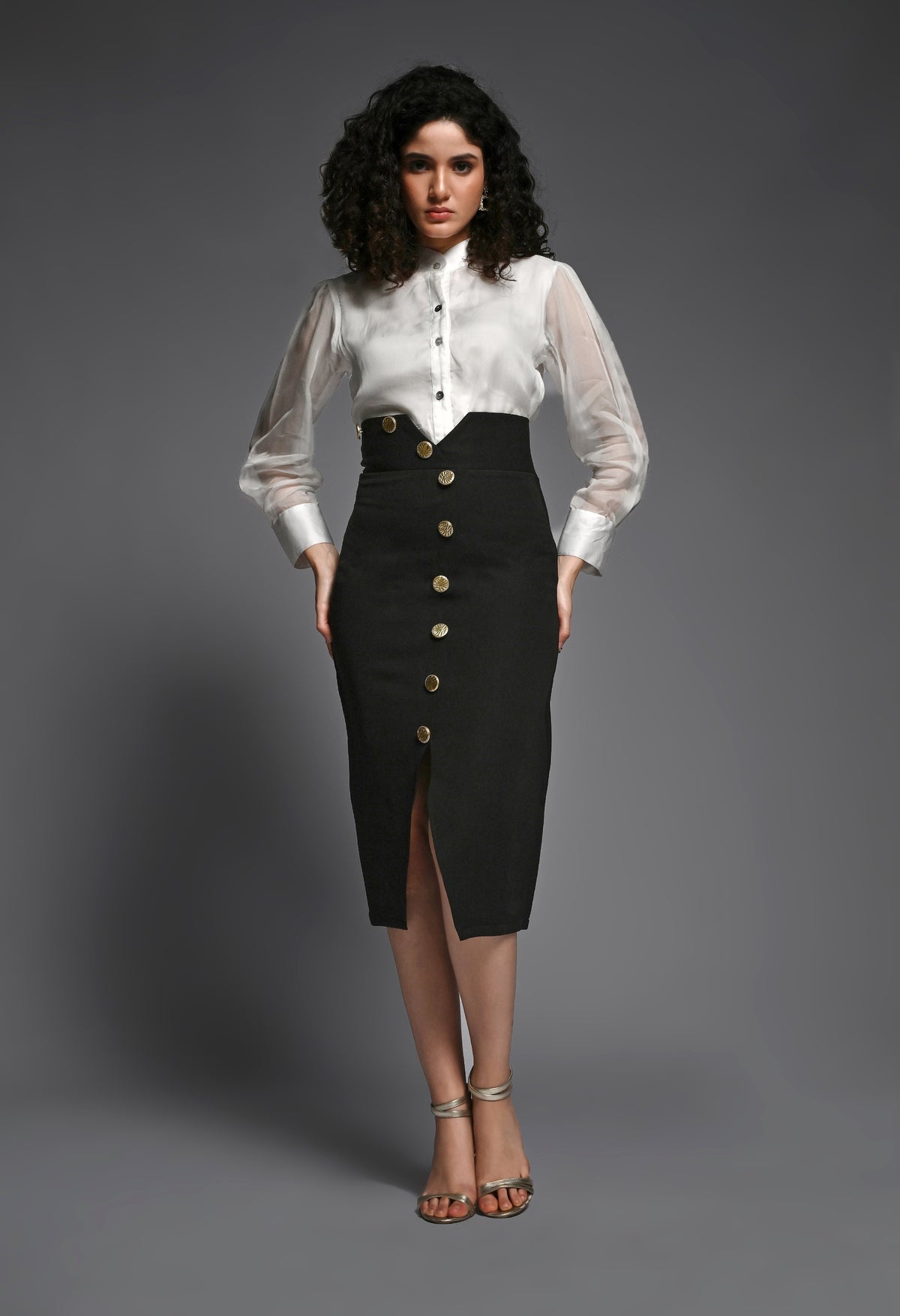 Black pencil skirt with golden buttons