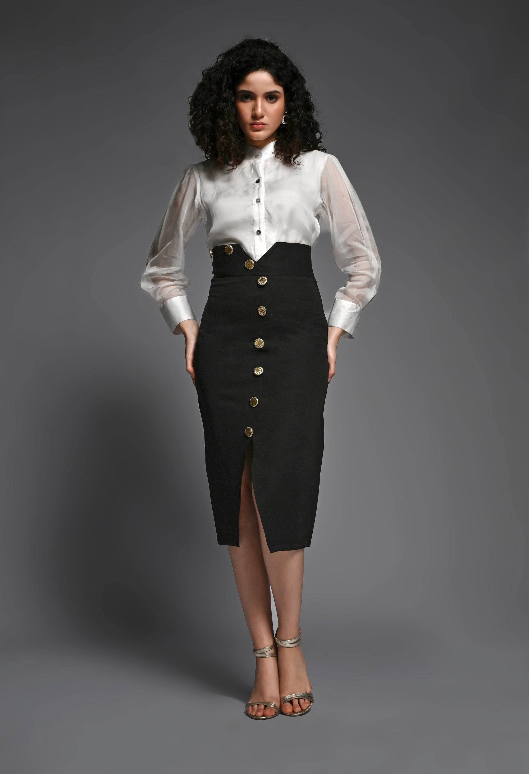 Black pencil skirt with golden buttons
