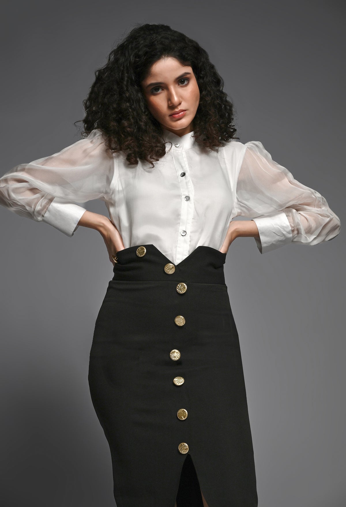 Black pencil skirt with golden buttons