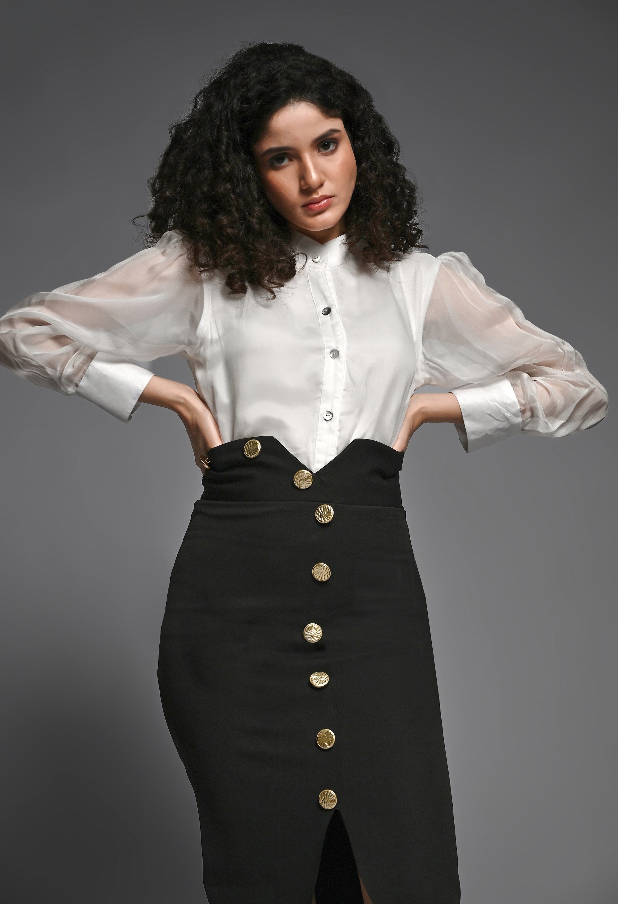 Black pencil skirt with golden buttons