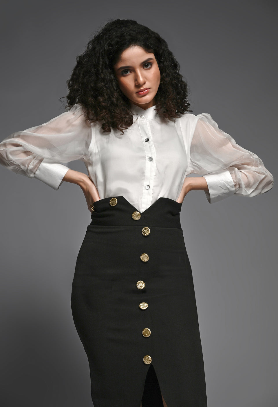 Black pencil skirt with golden buttons